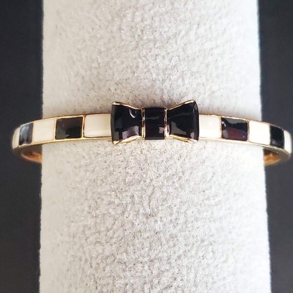 kate spade gold-tone enamel bow bangle with black and white inlay